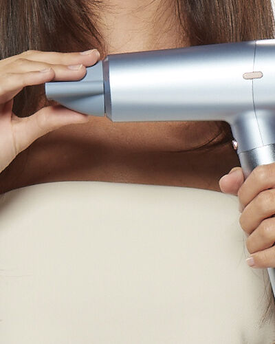 Hands holding a hair dryer
